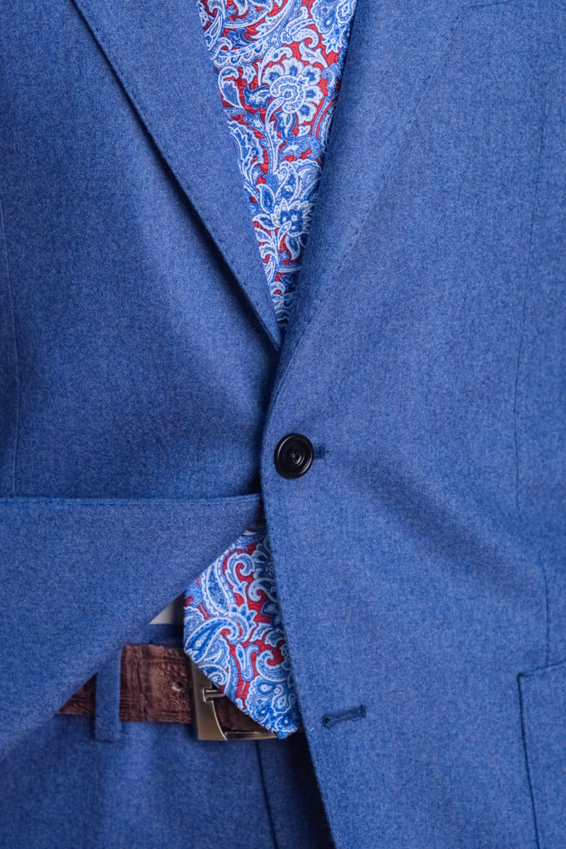 Close-up of a blue suit jacket with a patterned lining