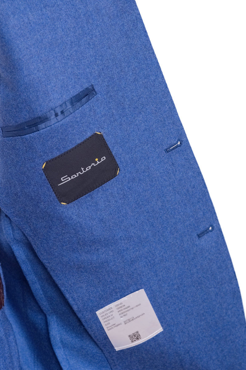 Blue fabric with Savio label on a white background